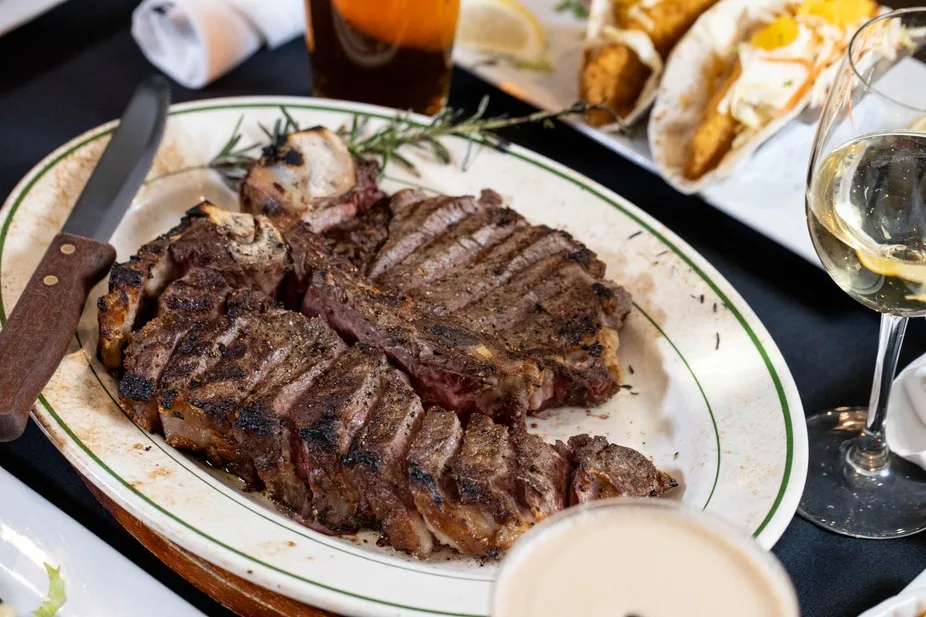 Porterhouse on the table with wine
