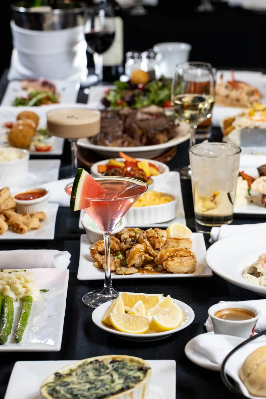 Table of cocktails and shared plates