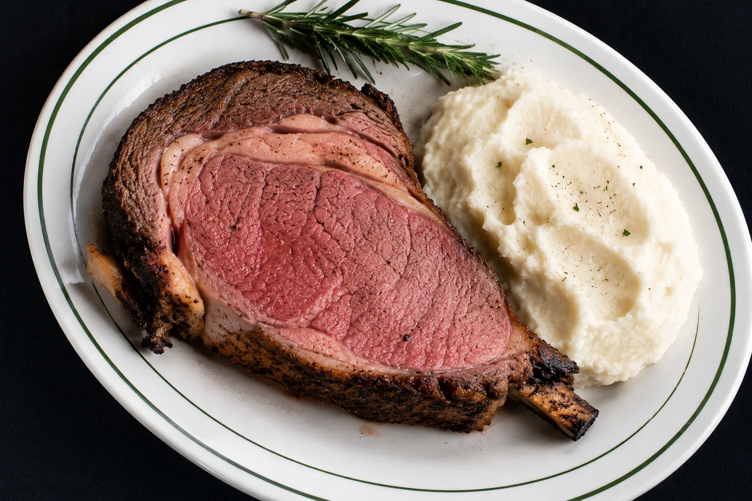 Bone-in prime rib with whipped mashed potatoes and rosemary